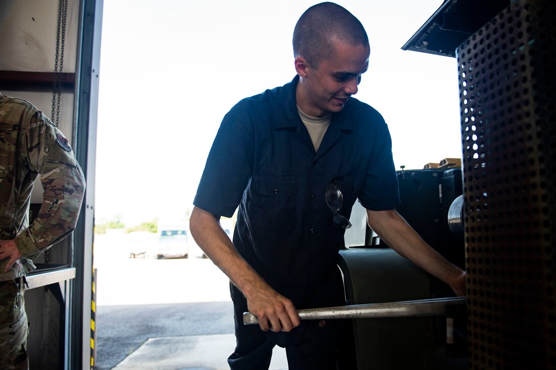 Airman 1st Class Alex Romero, 23d Logistics Readiness Squadron fire truck maintenance apprentice, unscrews a bolt before adding hydraulic fluid to a forklift Aug. 20, 2019, at Moody Air Force Base, Ga. Romero, a part of the materiel handling equipment section, focuses on the maintenance of cargo-based vehicles such as forklifts and k-loaders. The maintenance of these vehicles enable successful execution of operations, including the loading of cargo onto aircraft for deployments. (U.S. Air Force photo by Senior Airman Erick Requadt)