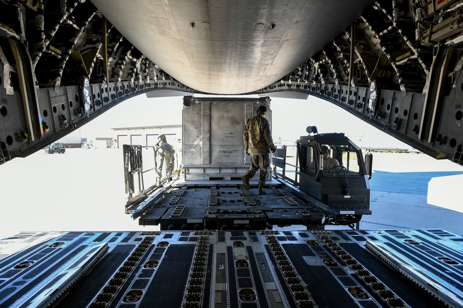 Airmen with the 75th Logistics Readiness Squadron unload cargo from a C-17 Globemaster III at Hill Air Force Base, Utah, Aug. 9, 2019. The C-17 is attached to the Reserve 89th Airlift Squadron assigned to the 445th Aircraft Wing out of Wright-Patterson AFB, Ohio. (U.S. Air Force photo by Cynthia Griggs)