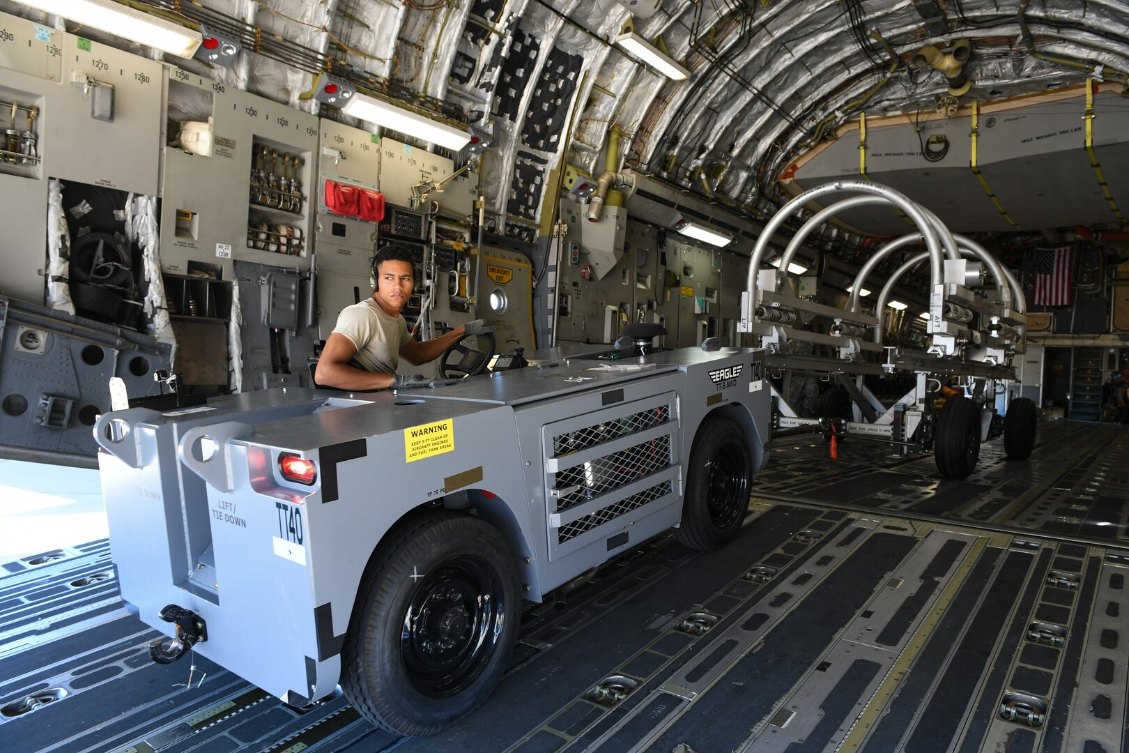 Senior Airman DeShain Calloway, 75th Logistics Readiness Squadron, unloads cargo from a C-17 Globemaster III at Hill Air Force Base, Aug. 9, 2019. The C-17 is attached to the Reserve 89th Airlift Squadron assigned to the 445th Aircraft Wing out of Wright-Patterson AFB, Ohio. (U.S. Air Force photo by Cynthia Griggs)