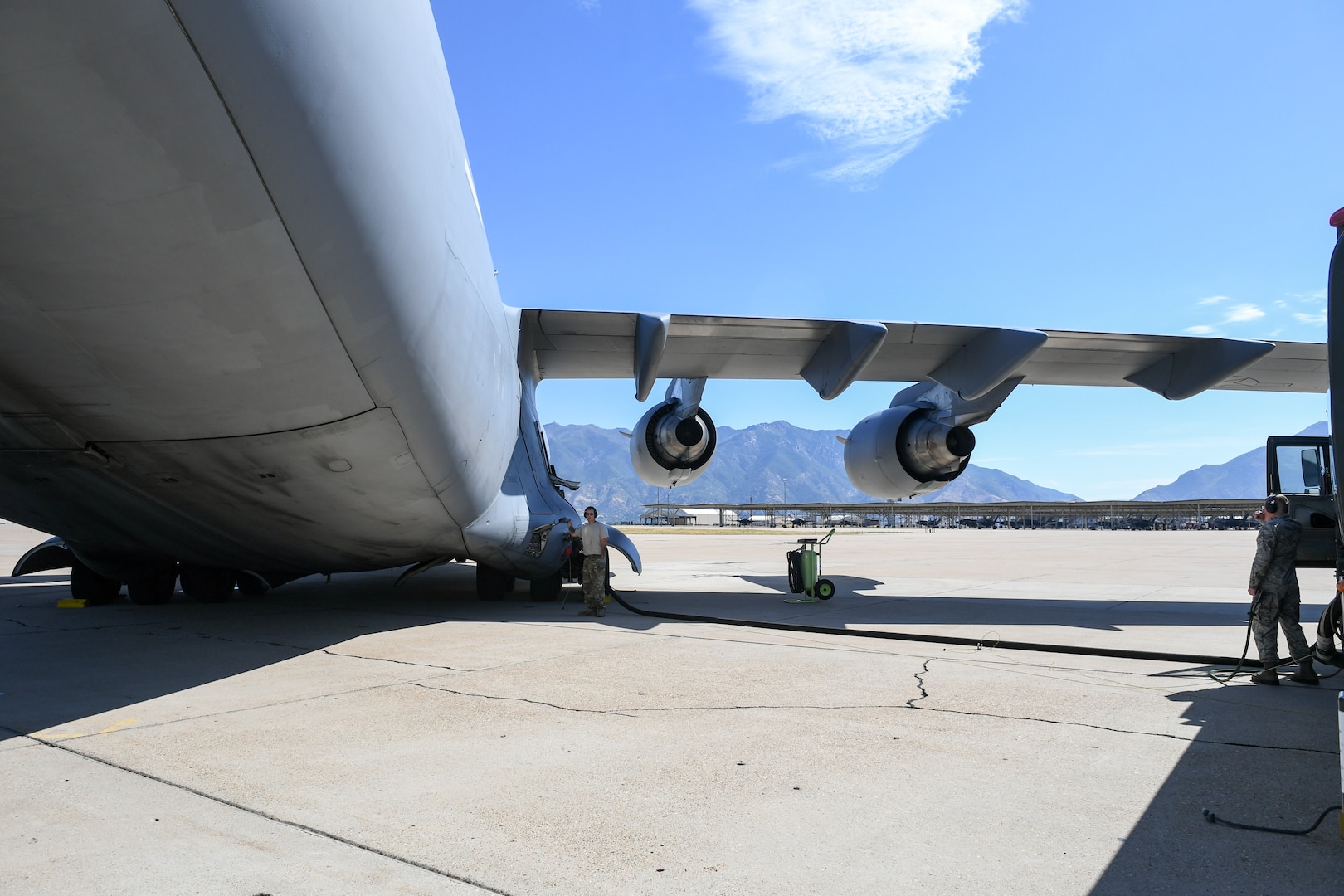 Crew Chief Tech. Sgt. Ronnie Calloway, 75th Logistics Readiness Squadron, fuels up a  C-17 Globemaster III at Hill Air Force Base, Utah, Aug. 9, 2019. The C-17 is attached to the Reserve 89th Airlift Squadron assigned to the 445th Aircraft Wing out of Wright-Patterson AFB, Ohio. (U.S. Air Force photo by Cynthia Griggs)