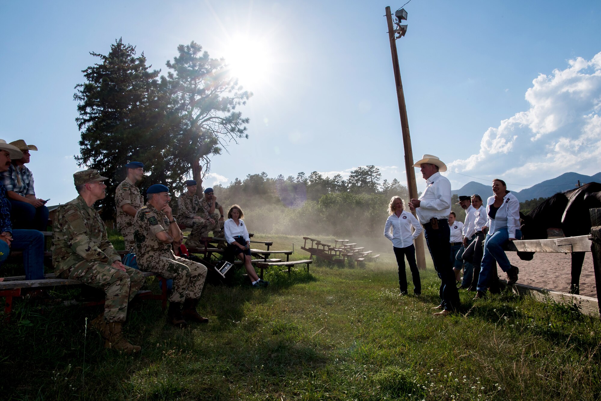 A contingency of Germany military health officials visit representatives from the Warrior Wellness program at the U.S. Air Force Academy equestrian center, Aug. 20, 2019. The program features equine therapy to promote self-confidence, problem solving, and improved mood through supervised interactions with horses  (U.S. Air Force photo/Trevor Cokley)