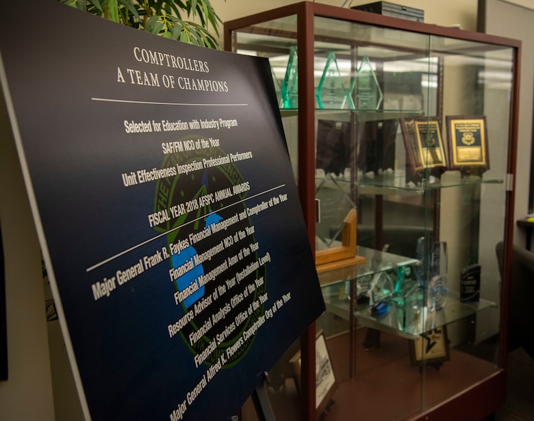 The 50th Comptroller Squadron displays unit awards for fiscal year 2018, Air Force Space Command and other awards at Schriever Air Force Base, Colorado, Aug. 21, 2019. The 50th CPTS prides themselves on being a champion team, earning seven different AFSPC level awards in 2018. (U.S. Air Force photo by Airman 1st Class Jonathan Whitely)