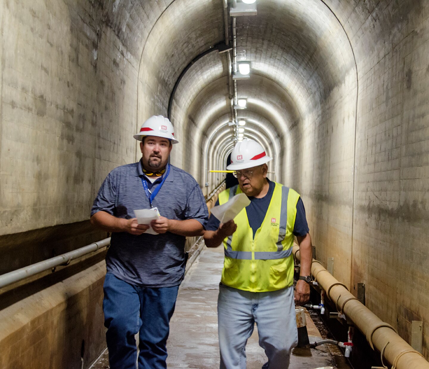 Camillo Chavarria, maintenance mechanic, John Martin Dam, USACE-Albuquerque District (right), discusses the operation of John Martin Dam with Riley Frazee, emergency manager, Colorado, during a tour of the dam following the exercise at Lamar Community College August 15, 2019.