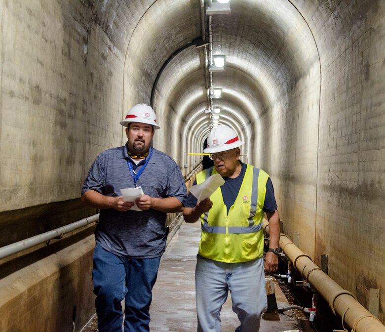 Camillo Chavarria, maintenance mechanic, John Martin Dam, USACE-Albuquerque District (right), discusses the operation of John Martin Dam with Riley Frazee, emergency manager, Colorado, during a tour of the dam following the exercise at Lamar Community College August 15, 2019.
