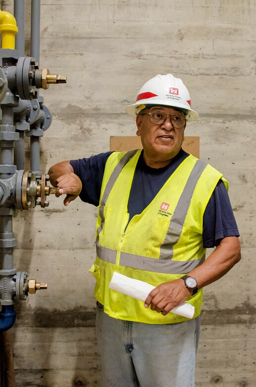Camillo Chavarria, maintenance mechanic, John Martin Dam, USACE-Albuquerque District (right) discusses the operation of the dam with stakeholders during a tour following the exercise at Lamar Community College August 15, 2019.