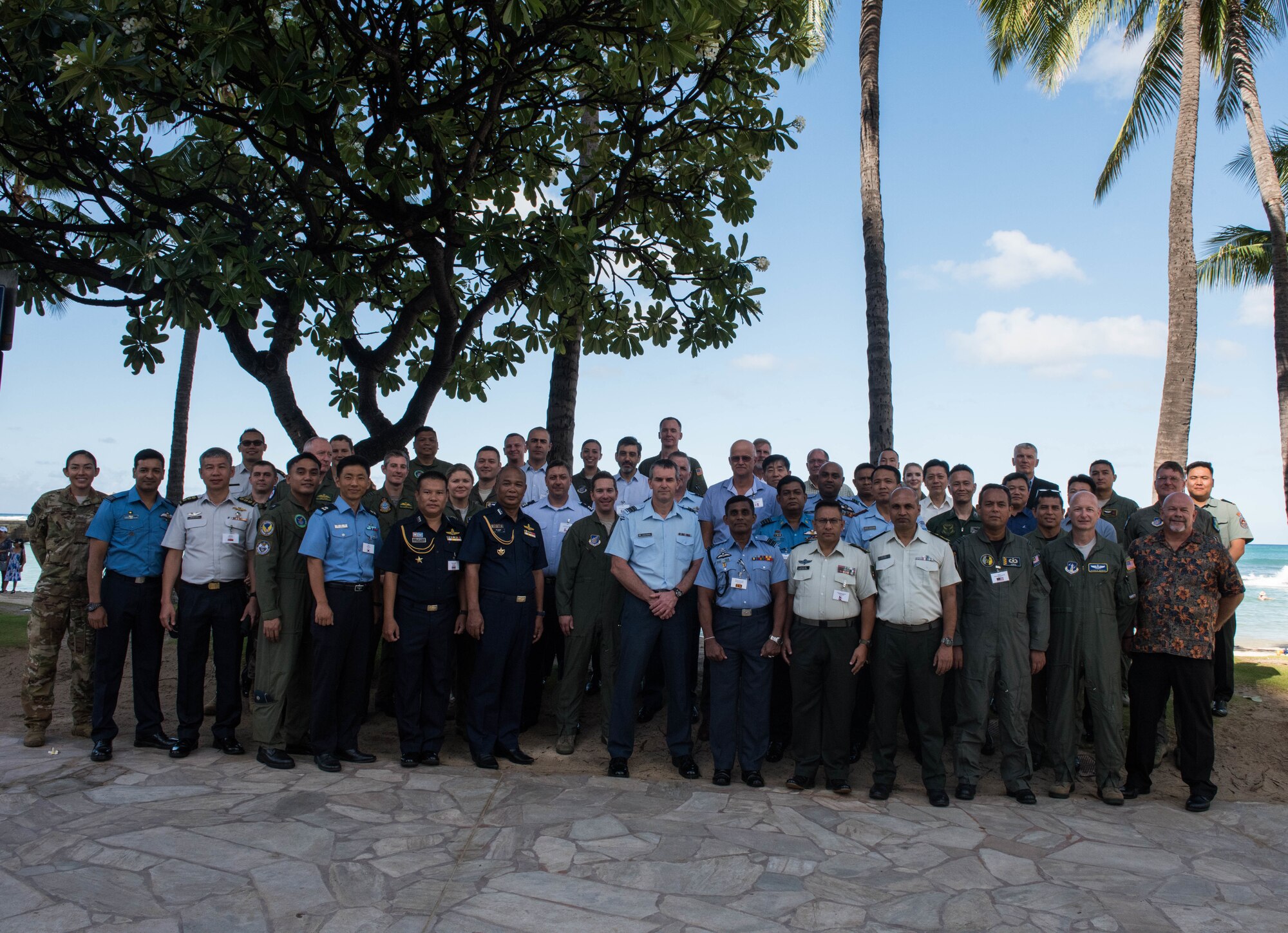 Attendees at the Indo-Pacific Safety Air Forces Exchange take a group photo in Waikiki, Hawaii, Aug. 20, 2019.