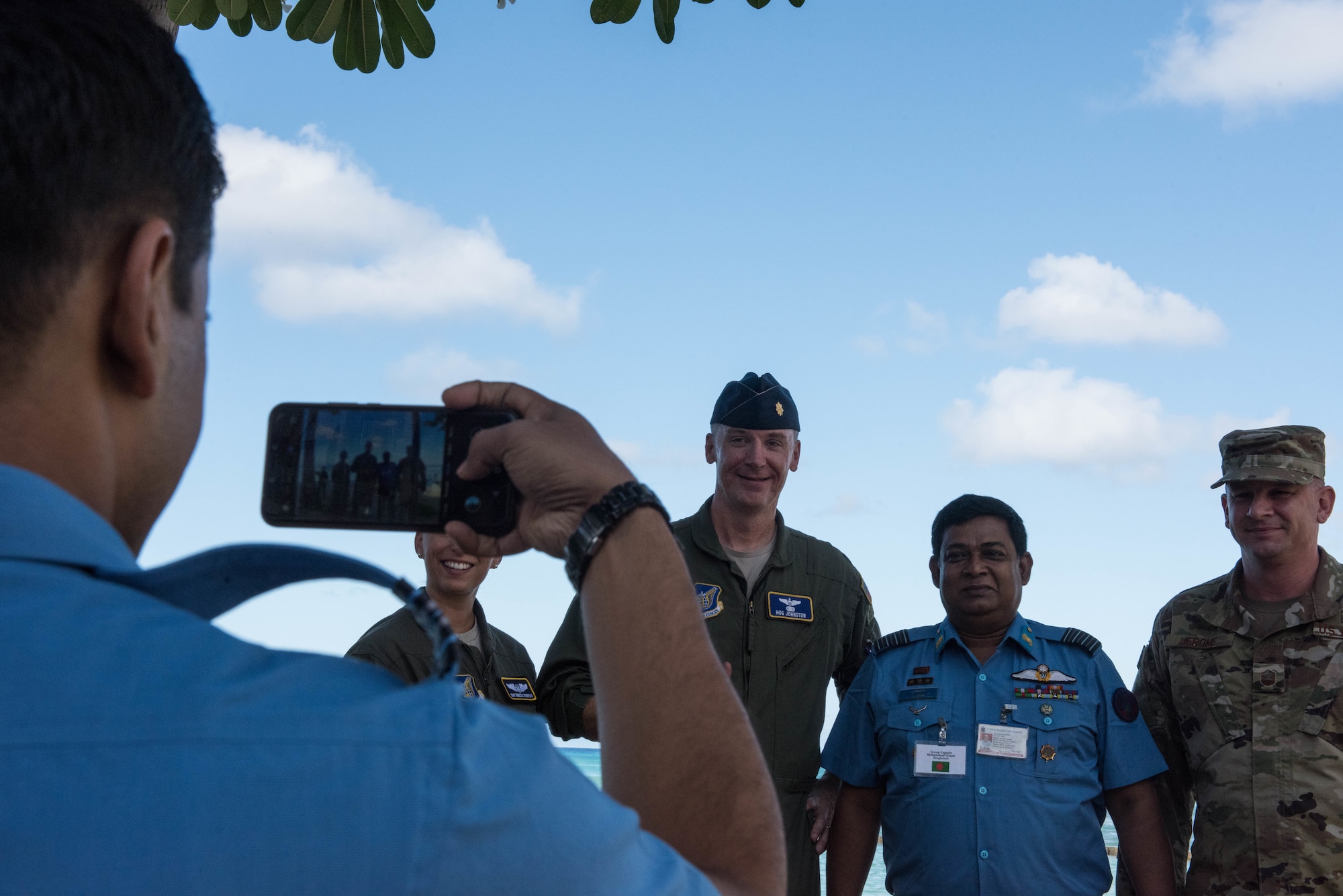 United States Air Force Airmen take a photo with a member from the Bangladesh Air Force during the Indo-Pacific Safety Air Forces Exchange in Waikiki, Hawaii, Aug. 20, 2019.