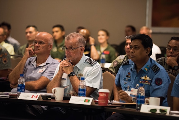 Attendees at the Indo-Pacific Safety Air Forces Exchange listen to a briefing on proactive aviation safety in Waikiki, Hawaii, Aug. 20, 2019.