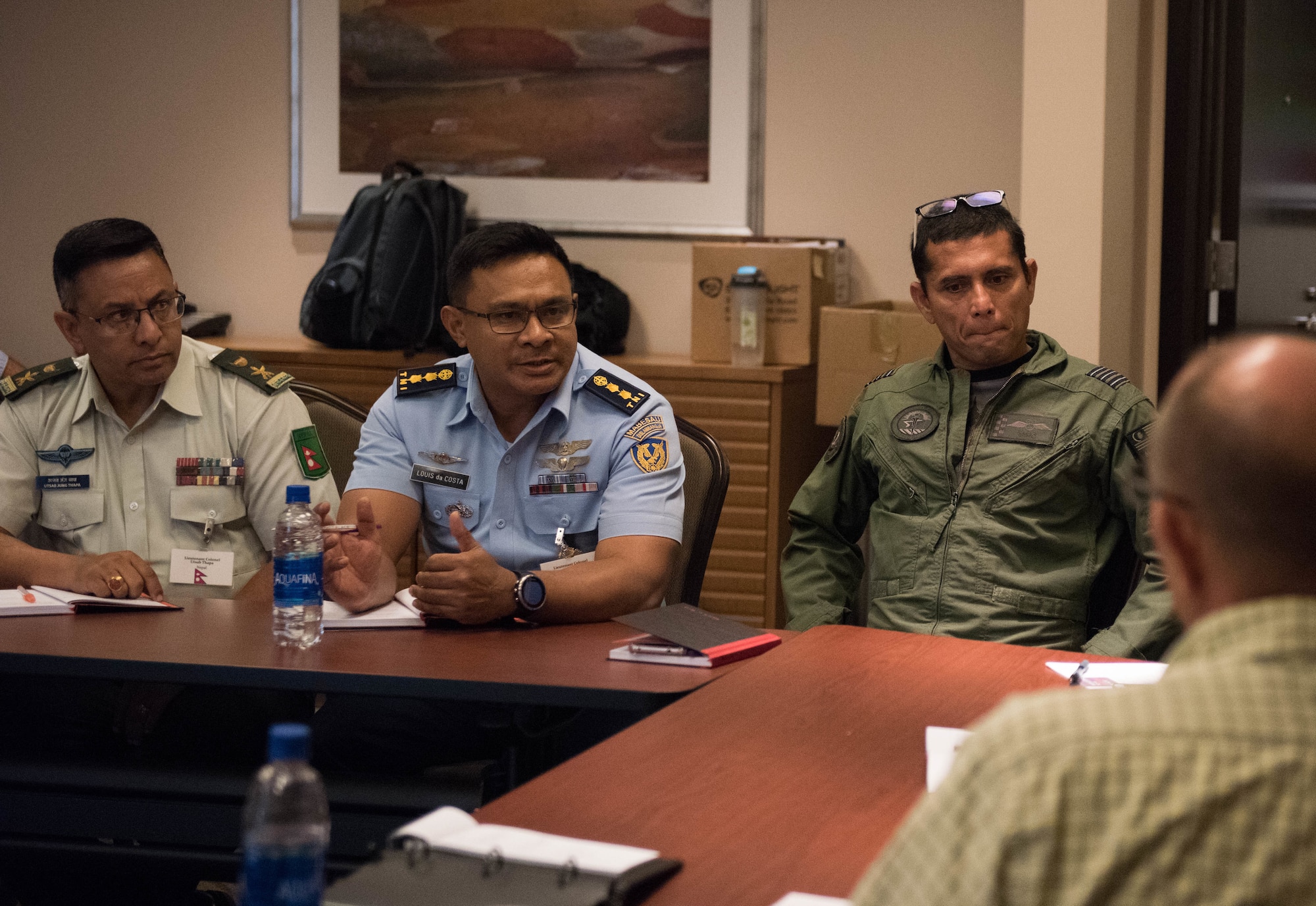 Attendees at the Indo-Pacific Safety Air Forces Exchange have a round-table discussion on aviation safety topics in Waikiki, Hawaii, Aug. 20, 2019.