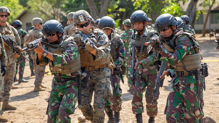 U.S. Marines with Alpha Company, 1st Battalion, 3rd Marine Regiment conduct MOUT training with Indonesian Marines during the Korps Marinir (KORMAR) Platoon Exchange 2019 program in Surabaya, Indonesia, August 9, 2019. The KORMAR platoon exchange program between Indonesia and the U.S. involves each country sending a platoon of Marines to live and train together at the other's military base. This program enhances the capability of both services and displays their continued commitment to share information and increase the ability to respond to crisis together. (U.S. Marine corps photo by Cpl. Eric Tso)