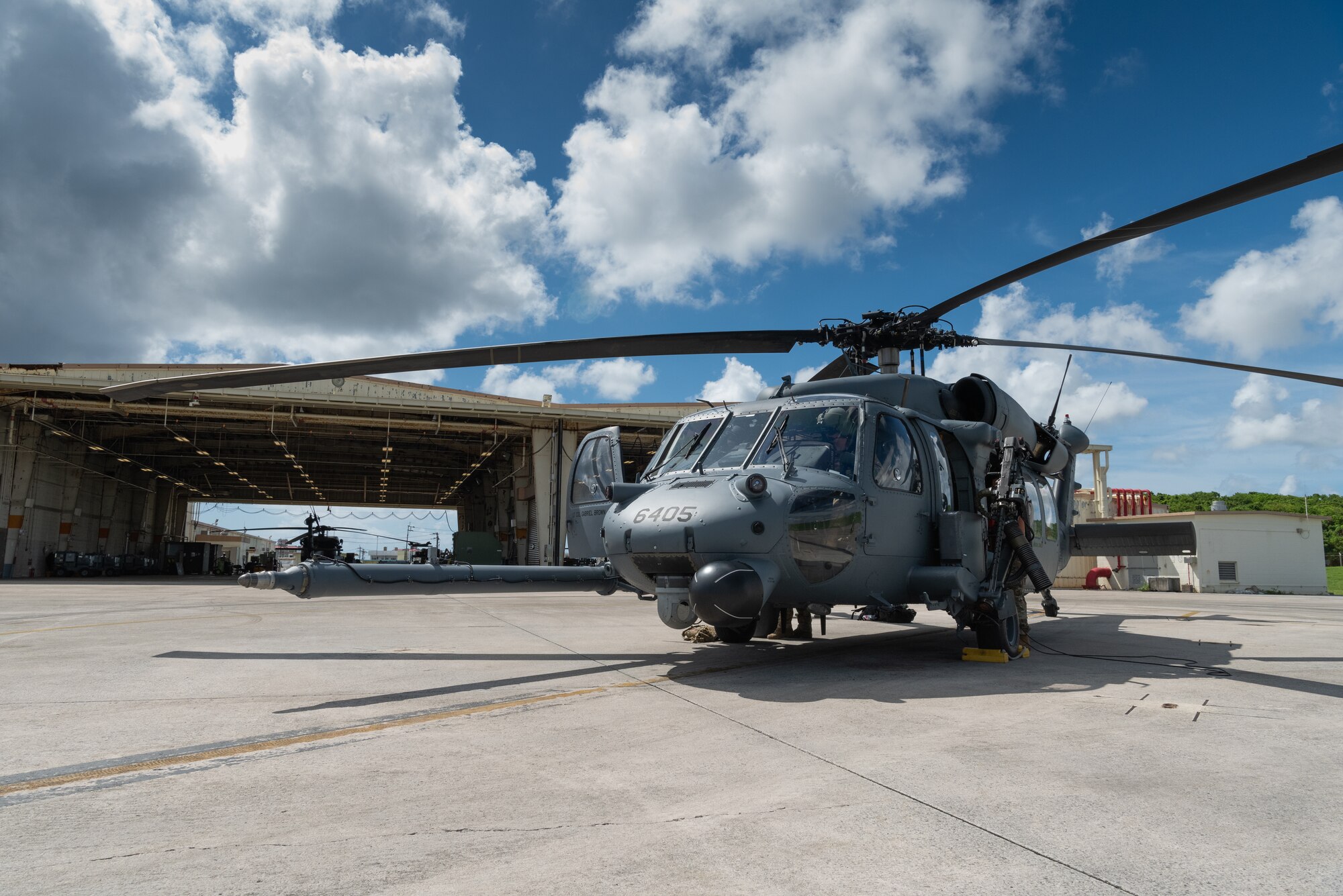 An HH-60G Pave Hawk from the 33rd Rescue Squadron sits on a taxiway, July 31, 2019, on Kadena Air Base, Japan. The HH-60G Pave Hawk’s primary function is to recover personnel in hostile conditions day and night, no matter the weather. (U.S. Air Force photo by Senior Airman Cynthia Belío)