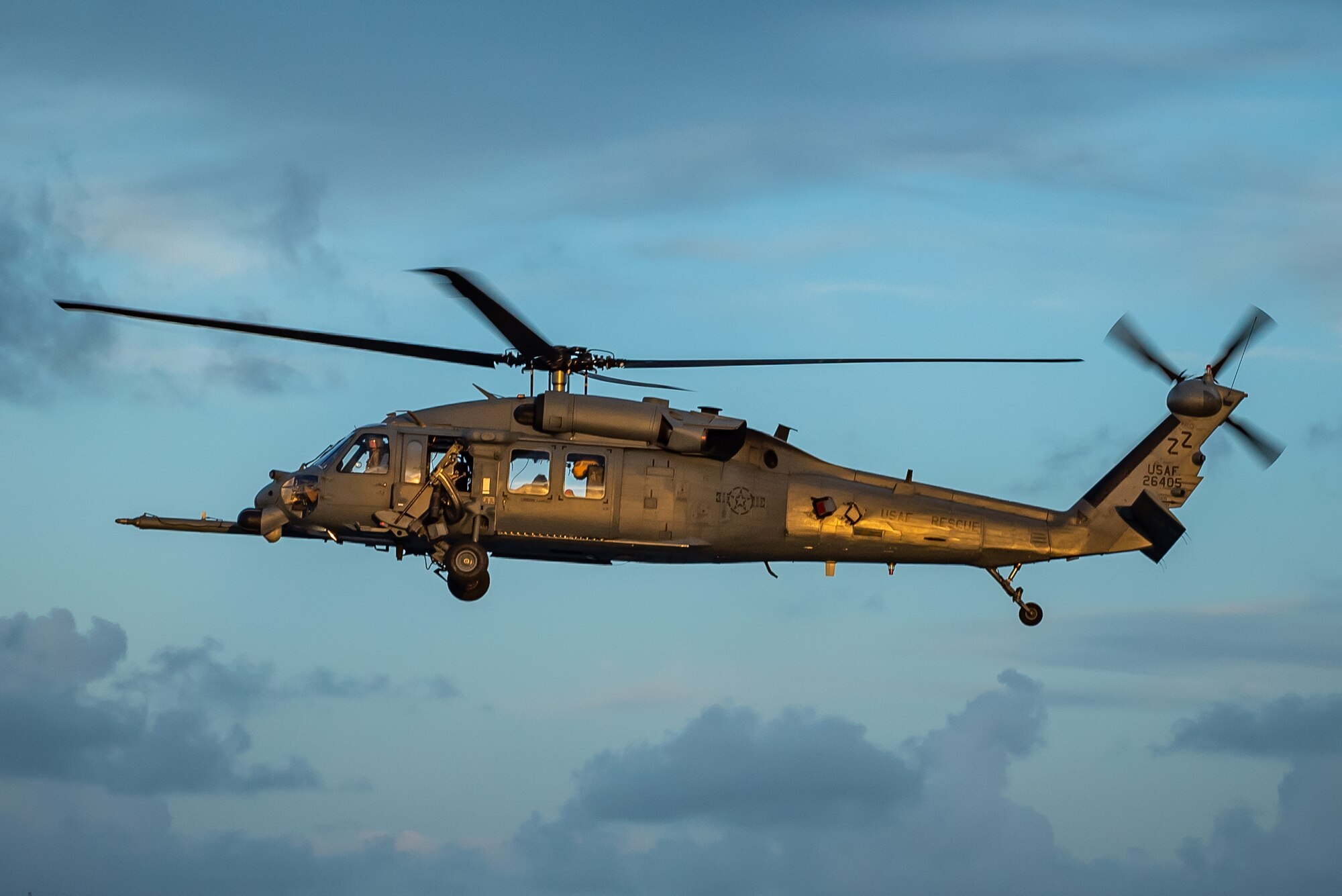 An HH-60G Pave Hawk from the 33rd Rescue Squadron flies during a training exercise, July 31, 2019, out of Kadena Air Base, Japan. The 33rd RQS’s motto is, ‘These things we do that others may live.’ (U.S. Air Force photo by Airman 1st Class Matthew Seefeldt)
