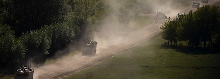 U.S. Army vehicles with 1st Armored Brigade Combat Team, 1st Infantry Division, convoy to their position in “the box” during the culminating force on force exercise of Combined Resolve XII at the Joint Multinational Readiness Center in Hohenfels, Germany Aug. 19, 2019.