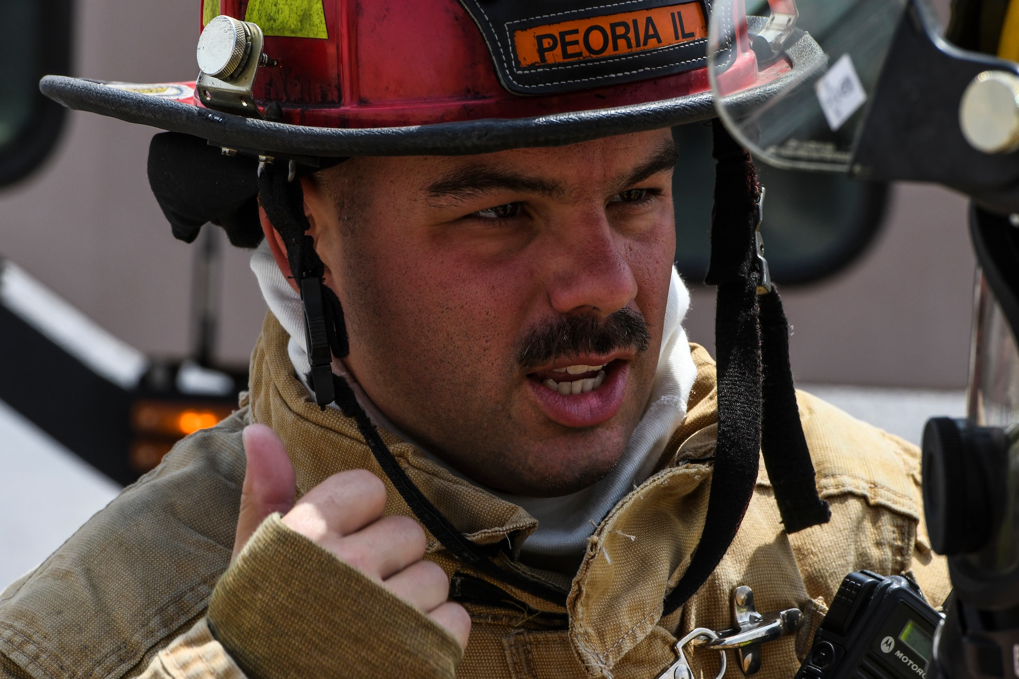 Tech. Sgt. Aaron Alcaraz, 407th Expeditionary Civil Engineer Squadron fire station captain, communicates with firefighters during an airfield exercise at Ahmed al-Jaber Air Base, Kuwait, Aug. 16, 2019. Several emergency service vehicles arrived on-scene and simulated putting out the fire in the MV-22 Osprey then providing immediate medical care to the victims. Firefighters and medical personnel included Airmen, Marines and Sailors. (U.S. Air Force photo by Senior Airman Lane T. Plummer)
