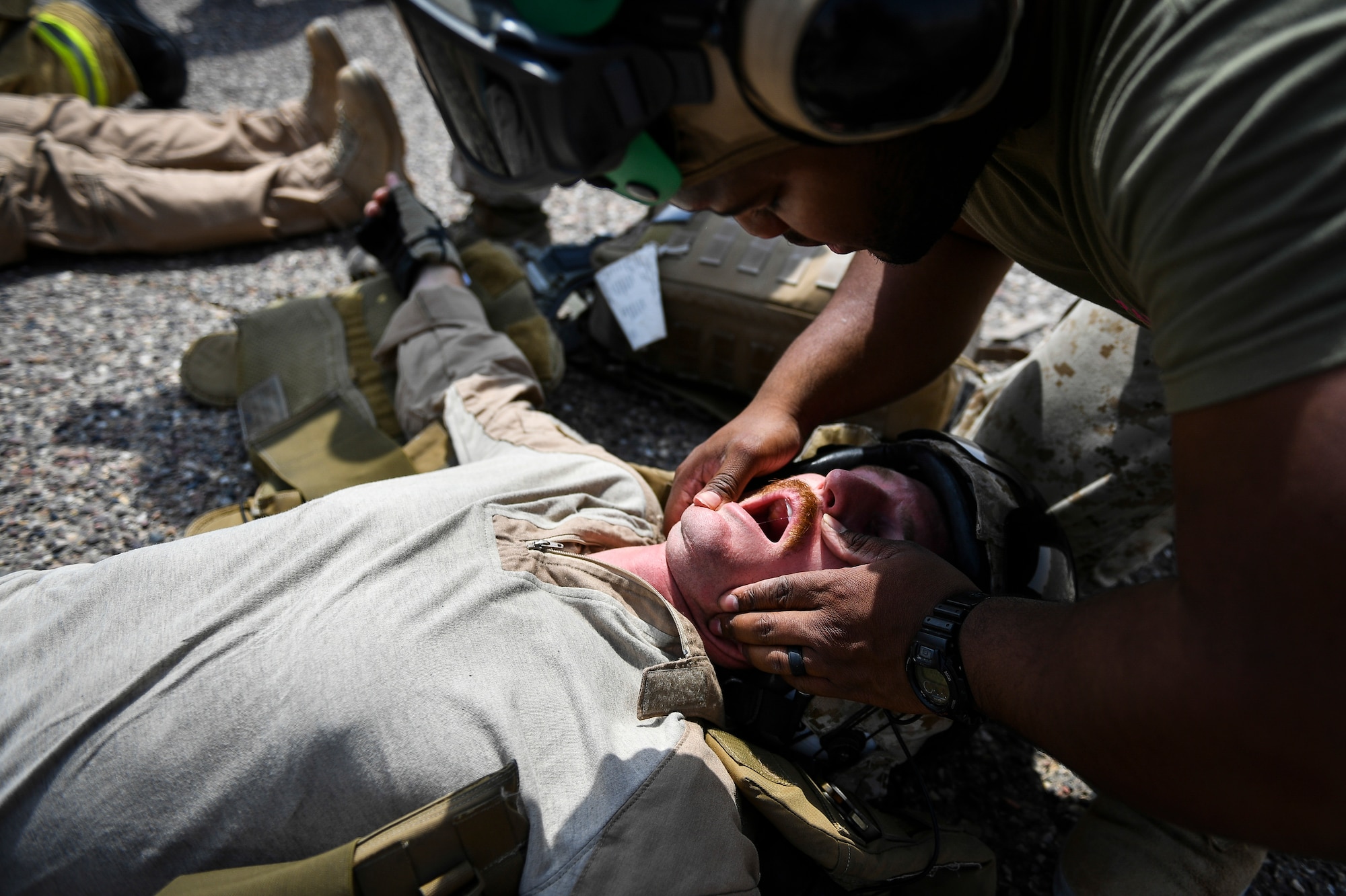 U.S. military service members participate in an airfield exercise at Ahmed al-Jaber Air Base, Kuwait, Aug. 16, 2019. The exercise was an opportunity for service members from multiple branches to cooperate on one of the most intense scenarios a firefighter could be called for: an aircraft on fire on the flightline. (U.S. Air Force photo by Staff Sgt. Mozer O. Da Cunha)