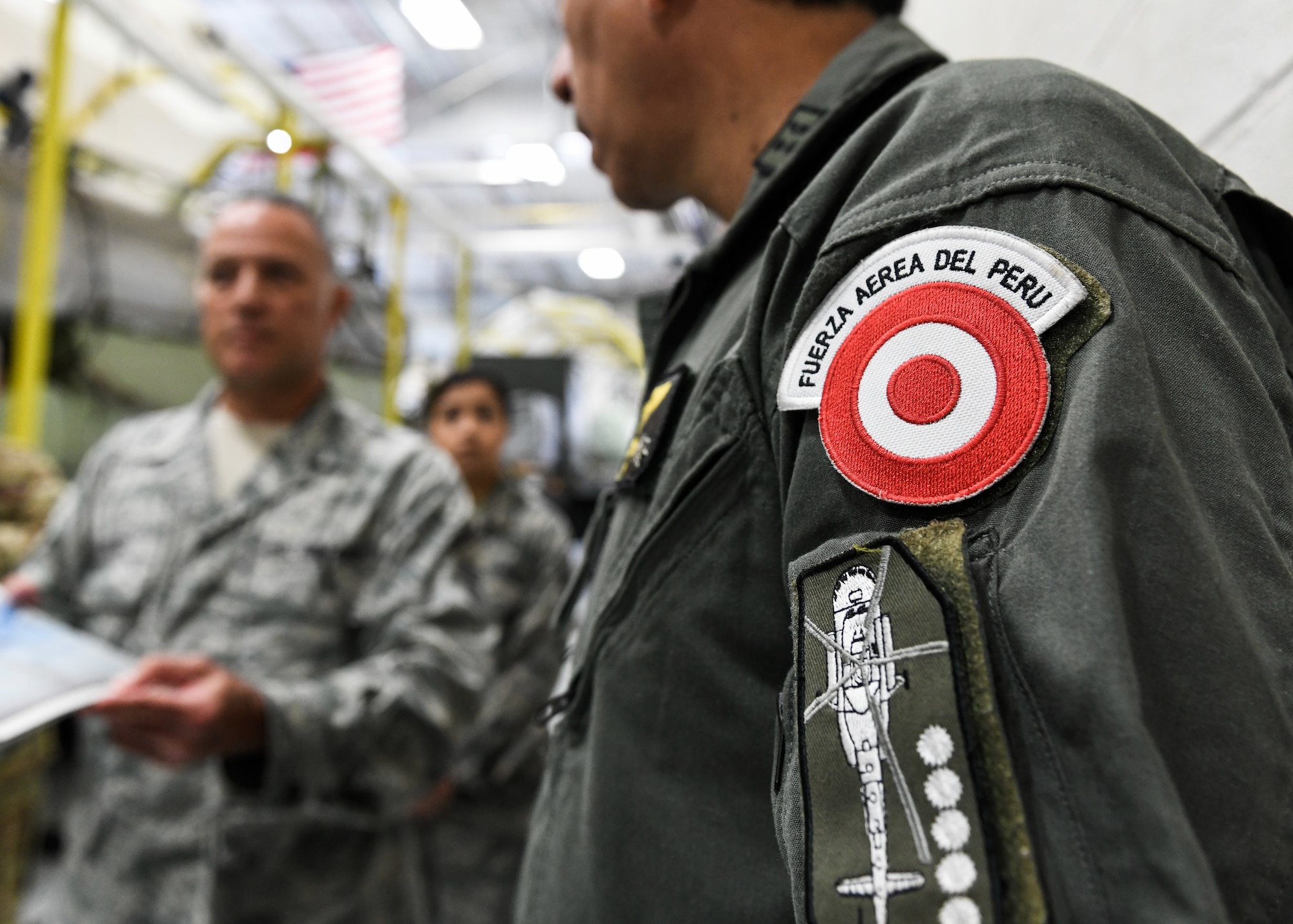 Peruvian Air Force Maj. Gen. Carlos G. Elera Camacho, the Assistant Defense and Air Attaché to the Embassy of Peru in the United States of America, watches a demonstration on the Modular Aerial Spray System (MASS), June 17, 2019, here.