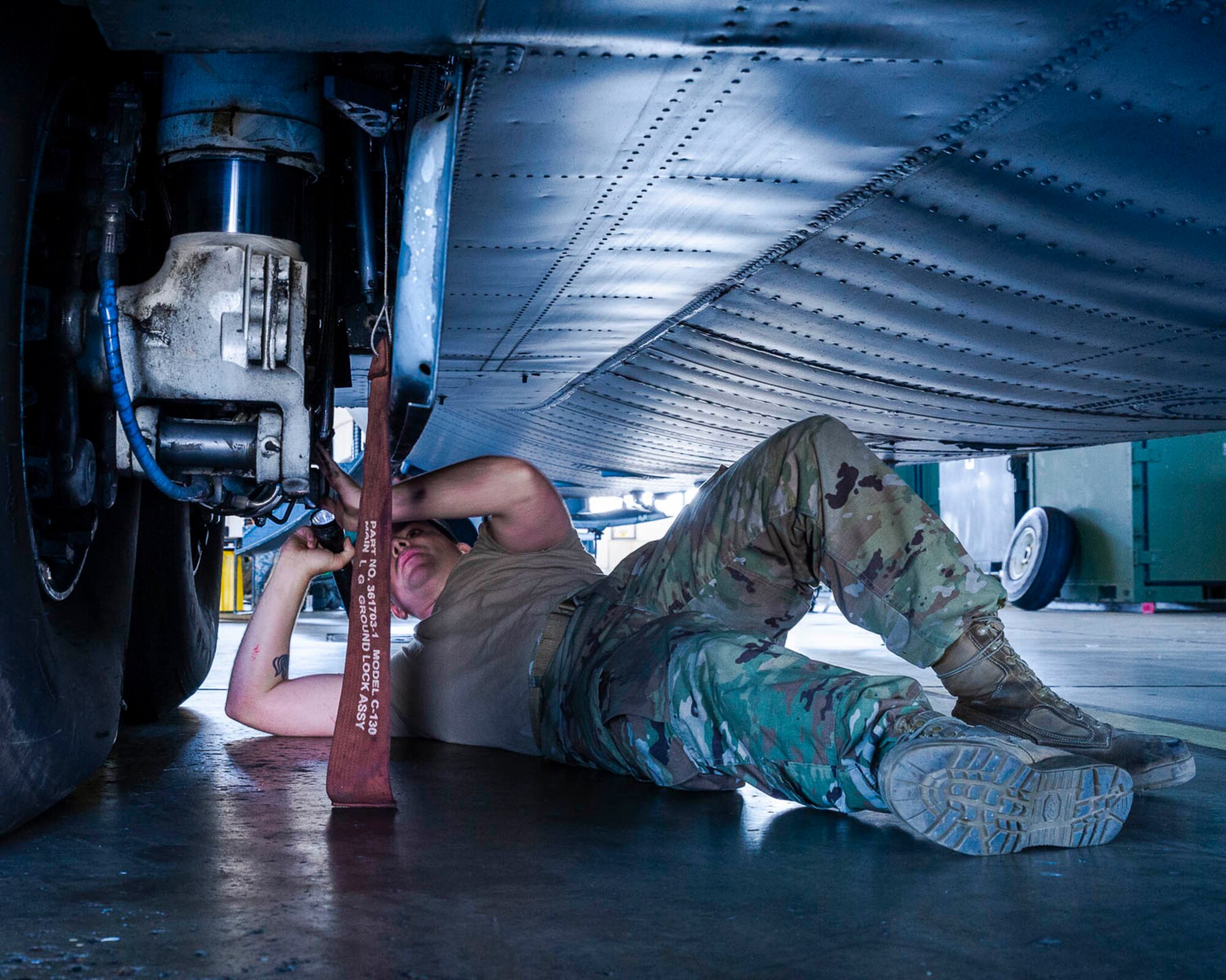 Air Force Reserve Airman from the 913th Maintenance Squadron work with 19th Airlift Wing active duty members to troubleshoot the landing gear of a C-130J Hercules on August 15, 2019, at Little Rock Air Force Base, Ark.  There are 20 Reserve members who work with Team Little Rock maintenance personnel to ensure combat airlift is available. Mobility aircraft, such as the C-130J, deliver critical personnel and cargo and provide airdrop of time-sensitive supplies, food and ammunition on a global scale. A critical part of the airlift capabilities are the efforts of the maintenance personnel who ensure the workhorse of the mobility force, the C-130, is always ready, always there! (U.S. Air Force Reserve photo by Maj. Ashley Walker)