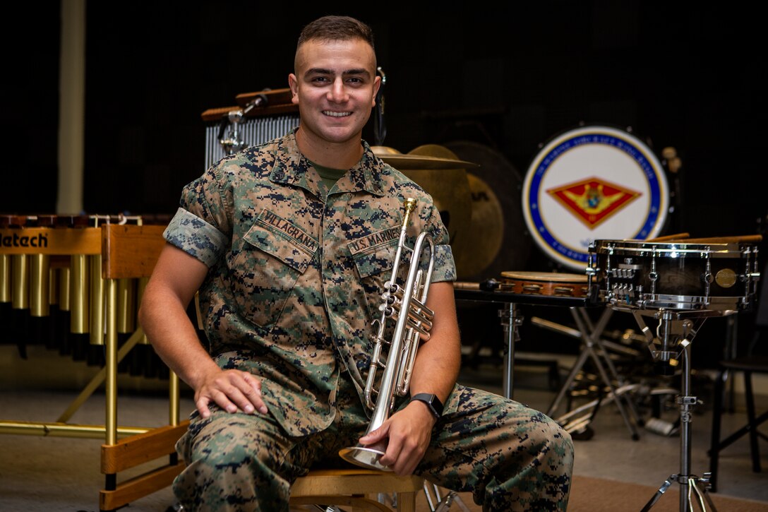 Cpl. Gilbert P. Villagrana, a musician with the 2nd Marine Aircraft Wing Marine Band, poses for a photo at Marine Corps Air Station Cherry Point, N.C., Aug. 12, 2019. "Joining the Marine Corps, joining the band was kind of a selfish act. This was for me. But for so long you do it for yourself and then real good performers realize it's not about you. It's about the people, and we're always performing for the people,” said Villagrana, an El Paso, Texas native. He was nominated for volunteering more than 150 hours for the Drum Corps International ensemble Carolina Crown, commendatory recognition as a trumpet specialist with the Quantico Marine Corps Band at the Virginia International Tattoo, and has been meritoriously promoted to corporal. (U.S. Marine Corps photo by Cpl. Ethan Pumphret)