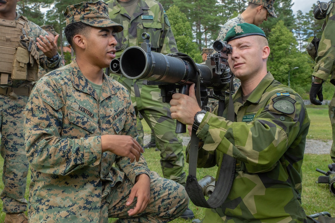 U.S. Marines with 1st Battalion, 8th Marines, Marine Rotational Force–Europe 19.2 and Swedish Marines from 1st Marine Regiment, learn about each other’s display their equipment and weapon systems in Berga Naval Base, Sweden, Aug. 19, 2019. Archipelago Endeavor 19 is an annual bilateral integrated field-training exercise, conducted to promote interoperability, strengthen partnerships, and enhance strategic and tactical cooperation between U.S. and Swedish Marines.