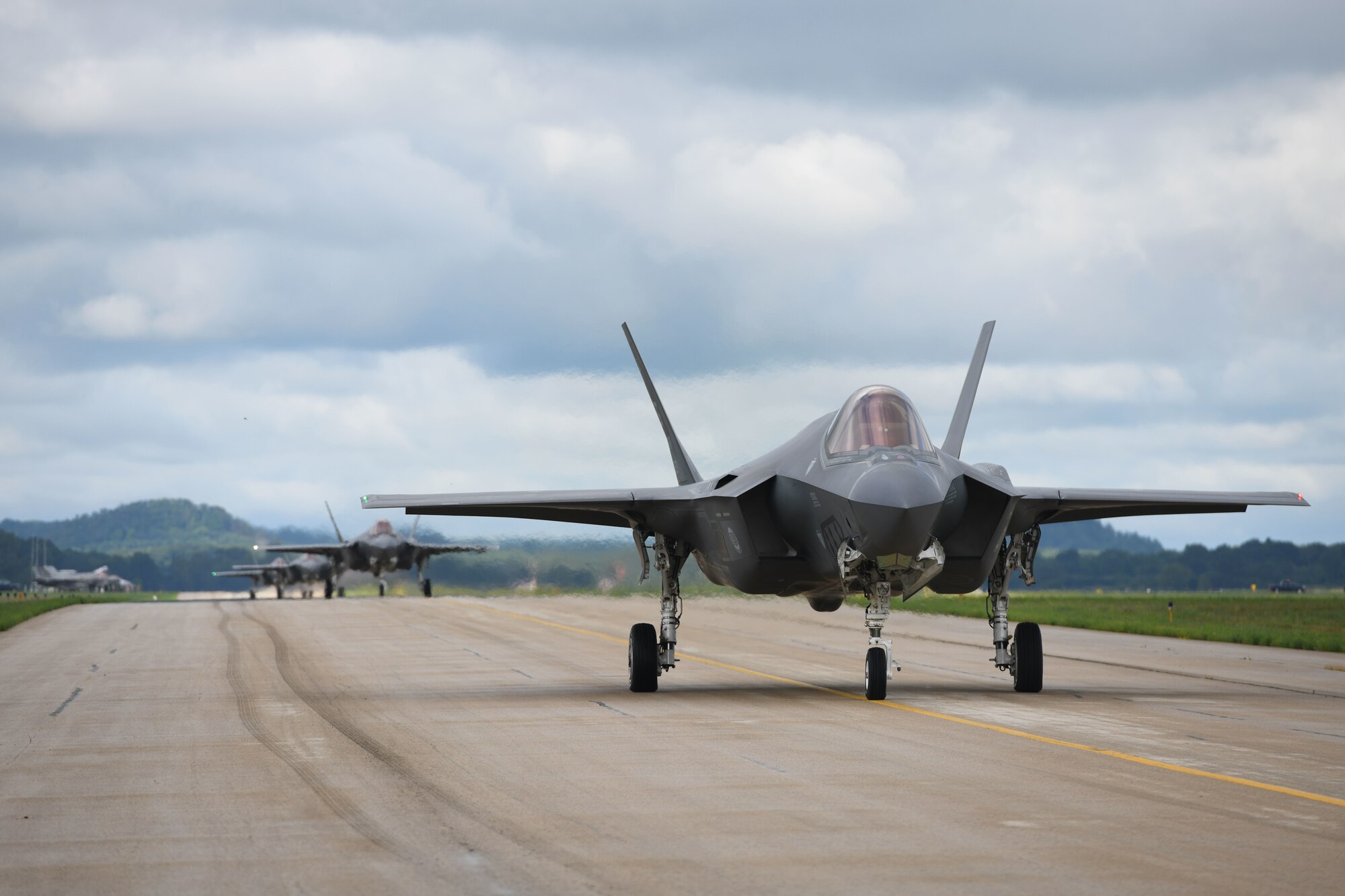 Several 33rd Fighter Wing F-35A Lightning IIs taxi down the Volk Field, Wisconsin. runway, during the Northern Lightning exercise, Aug. 13, 2019. Northern Lightning is a joint total force exercise that provides tactical-level, high-end training for current and future weapons platforms. (U.S. Air Force photo by Airman 1st Class Heather Leveille)