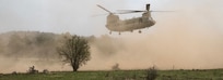 A U.S. Army CH-47 Chinook helicopter assigned to the 1st Infantry Division’s 1st Combat Aviation Brigade prepares to land in a field during exercise Allied Spirit X before conducting light, tactical, all-terrain vehicles training with Special Operations Forces in Hohenfels, Germany April 13, 2019.