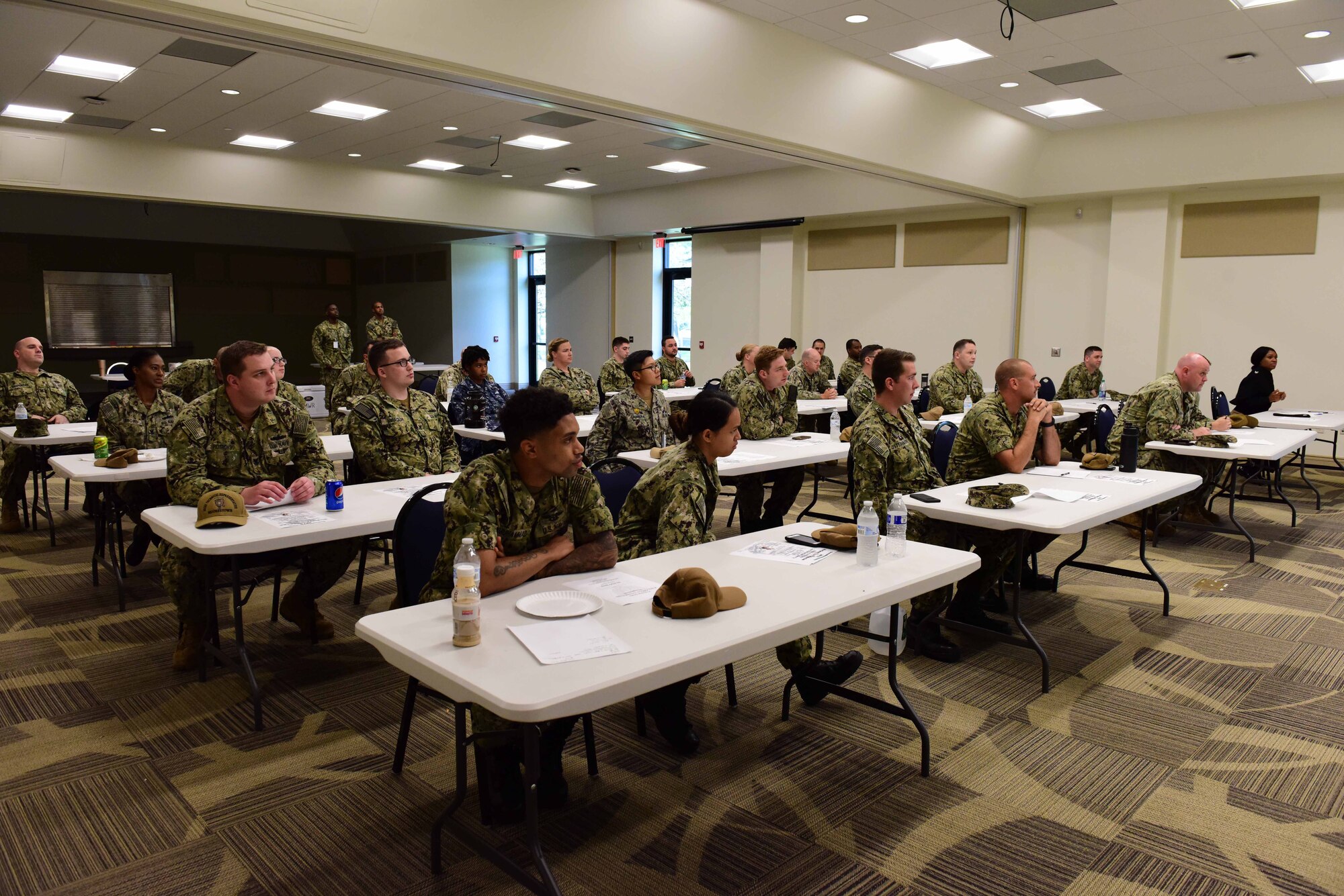 Sailors from Joint Base McGuire-Dix-Lakehurst, New Jersey attend discussions for the Garden State Petty Officer Second Class Symposium at Naval Air Engineering Station Lakehurst Flight Deck on Aug. 15, 2019. The symposium is designed to build leadership foundations for E-4’s and E-5’s in the U.S. Navy. (U.S. Air Force photo by Airman 1st Class Shay Stuart)