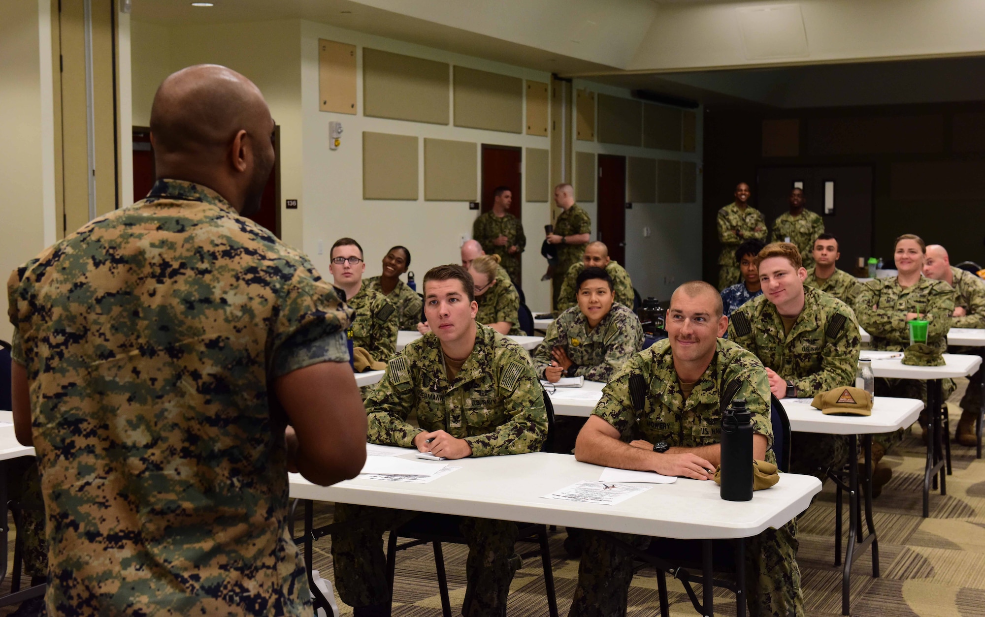 Sailors from Joint Base McGuire-Dix-Lakehurst, New Jersey attend the “Full Time Support” discussion at Naval Air Engineering Station Lakehurst Flight Deck on Aug. 15, 2019. This was part of the Garden State Petty Officer Second Class Symposium designed to build leadership foundations for E-4’s and E-5’s in the U.S. Navy. (U.S. Air Force photo by Airman 1st Class Shay Stuart)