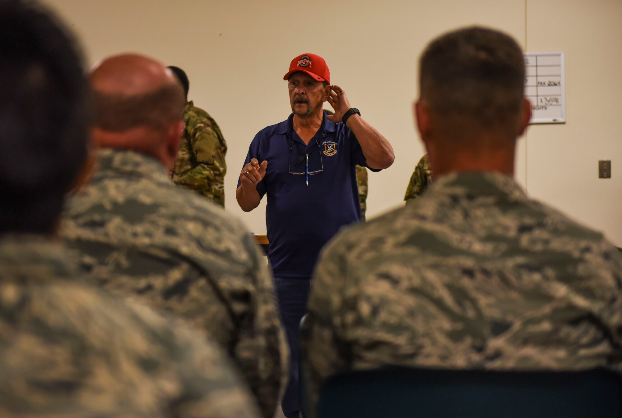 Guy Conley, 92nd Security Forces Squadron plans and programs chief, gives a brief to incoming Exercise Mobility Guardian 2019 personnel August 16, 2019, at Fairchild Air Force Base, Washington.