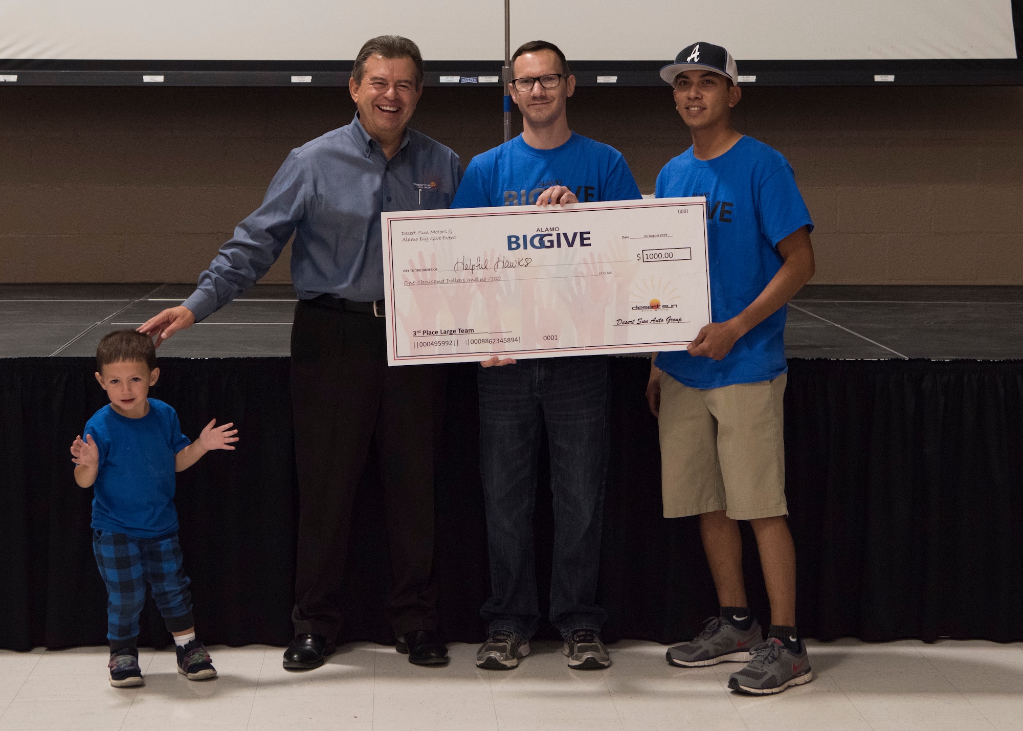 Members of team Helpful Hawks accept a check for winning the 3rd place in the large team category as part of the 2019 Alamo’s Big Give closing ceremony, August 22, at the Willie Estrada Civic Center in Alamogordo, N.M. This was the 12th year of Alamo’s Big Give which has saved the Otero community over $2,000,000 through community service. (U.S. Air Force photo by Staff Sgt. BreeAnn Sachs)
