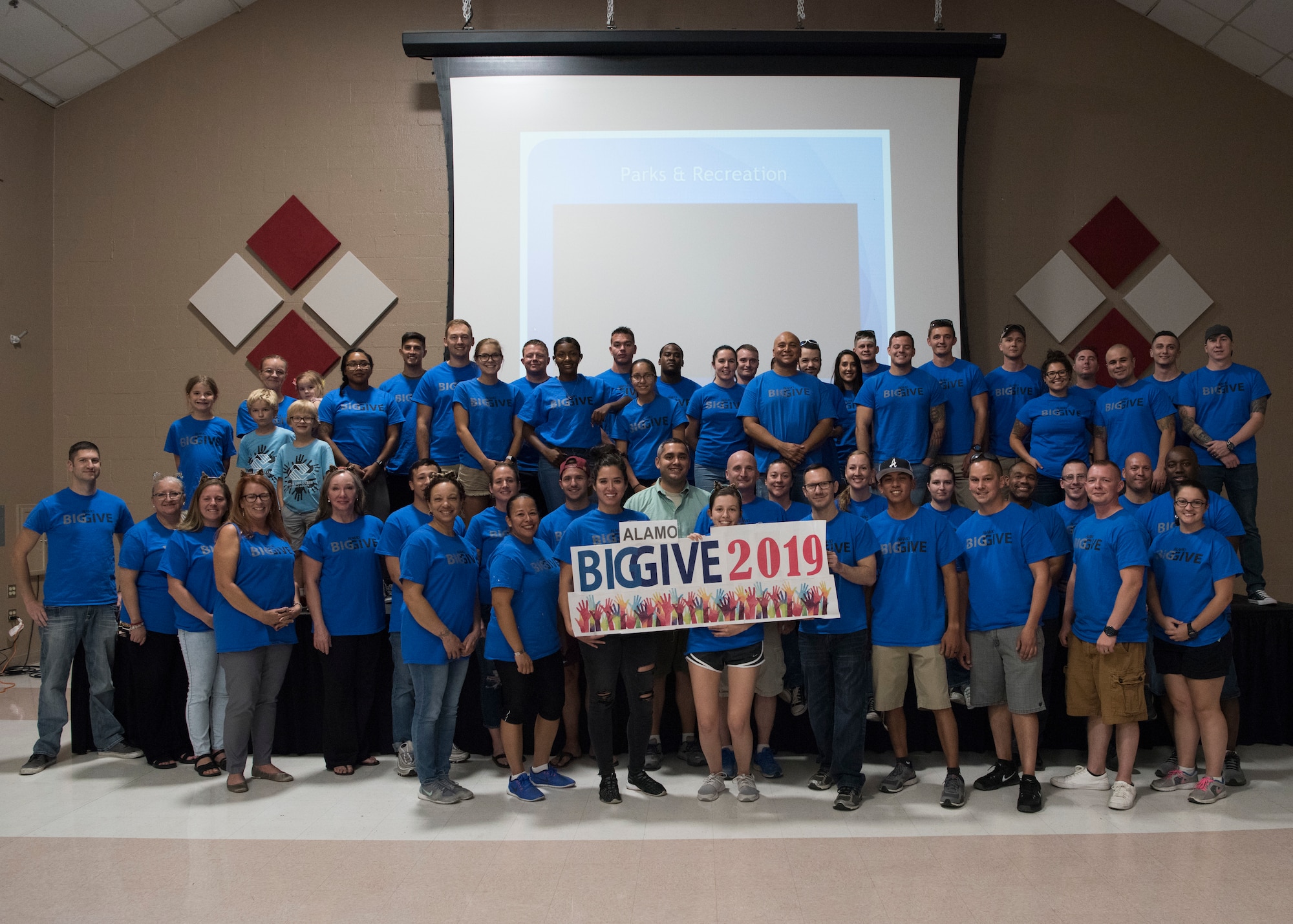 Volunteers with the 2019 Alamo’s Big Give pose for a photo during the closing ceremony, August 22, in the Willie Estrada Civic Center in Alamogordo, N.M. This was the 12th year of Alamo’s Big Give which has saved the Otero community over $2,000,000 through community service. (U.S. Air Force photo by Staff Sgt. BreeAnn Sachs)