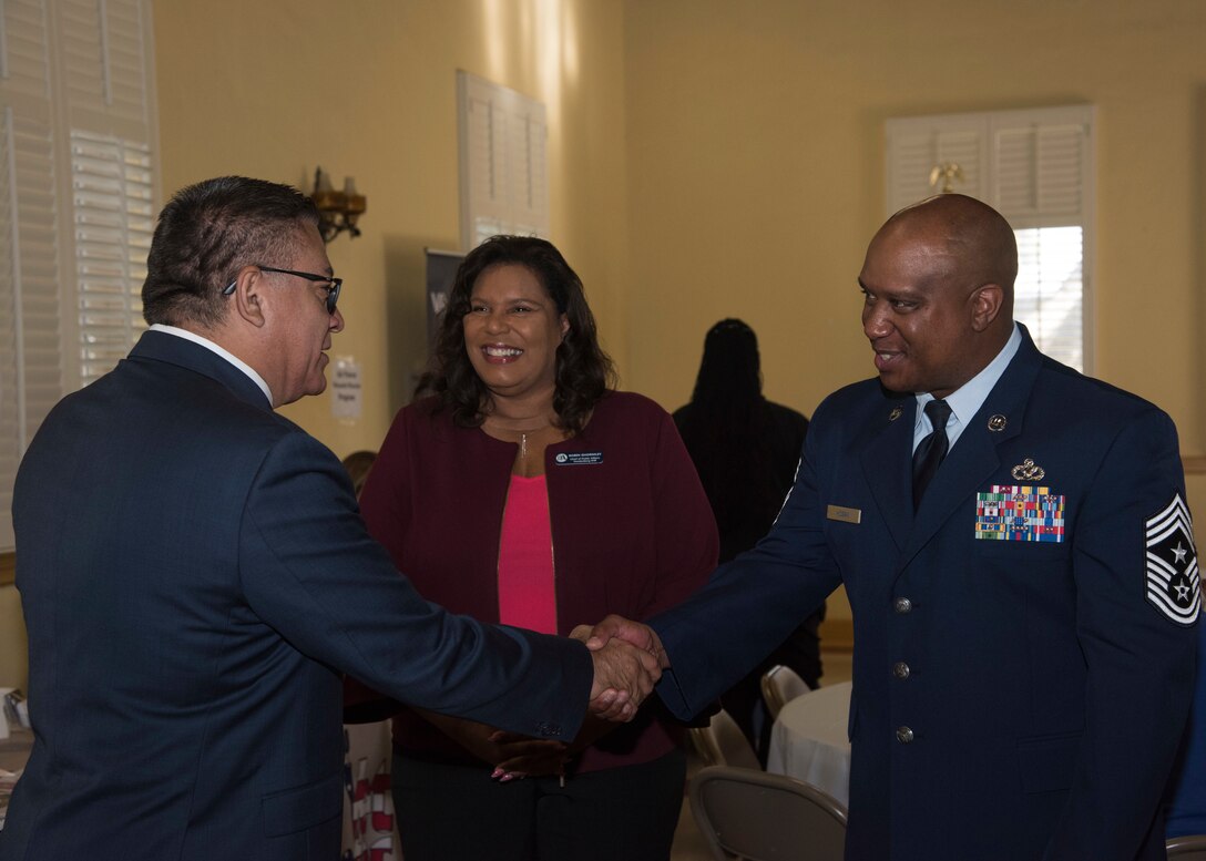 Chief Master Sgt. Darryl Hogan, 30th Space Wing command chief, and Robin Ghormley, 30th Space Wing Public Affairs chief, greet Rep. Salud Carbajal, United States congressman, during the third annual Veteran’s Breakfast hosted by Carbajal Aug. 21, 2019, at Lompoc Veterans Memorial Building in Lompoc, Calif. Members from Vandenberg AFB and local communities joined Carbajal at his breakfast, where he provided updates on local veteran support programs. (U.S. Air Force photo by Airman 1st Class Aubree Milks)
