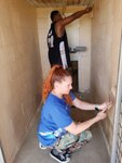Master Sgt. Melissa Erwin and Anthoney Smith, 340th Flying Training Group, volunteered a few hours last week to paint dog kennels at the Humane Society of New Braunfels Area shelter in New Braunfels, Texas.
