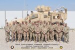 Members of the 1st Theater Sustainment Command's Syrian Logistics Cell stand for a group photo in Erbil, Iraq.