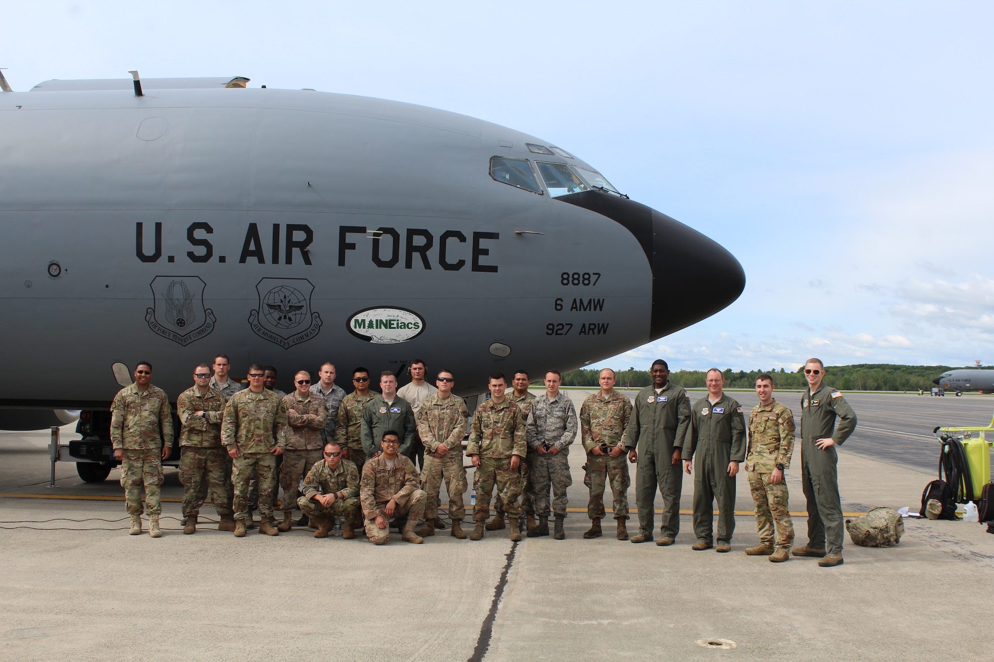 U.S. Air Force Airmen stand with a recovered KC-135 Stratotanker Aug. 4, 2018, at Bangor Air National Guard Base, Maine.