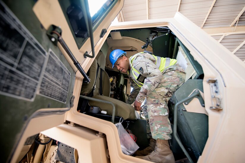 Sgt. 1st Class Roy Carson, maintenance quality assurance for wheeled vehicles, 401st Army Field Support Battalion-Kuwait, completes an inspection of a military supply truck Aug. 10 at Army Prepositioned Stocks-5, Camp Arifjan, Kuwait.