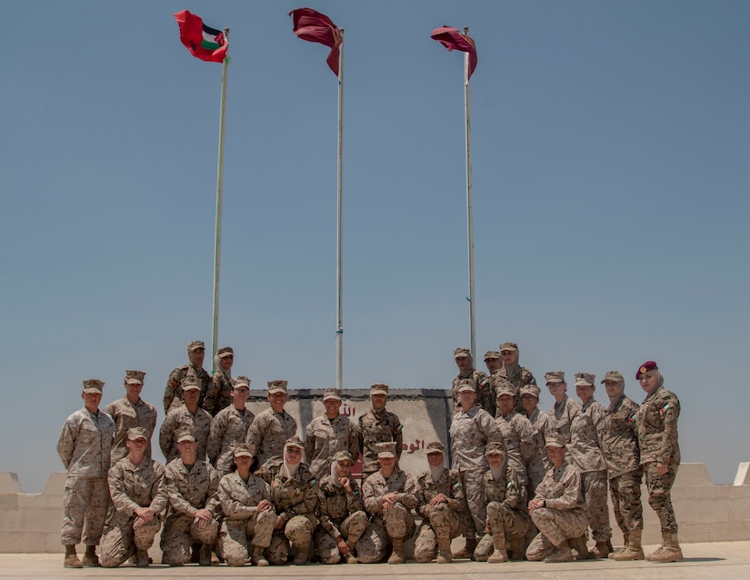 The 11th Marine Expeditionary Unit Female Engagement Team (FET) pose with the Jordan Armed Forces-Arab Army Quick Reaction Force FET for a group photo after subject matter expert exchange between the two countries August 5, 2019. The U.S. is committed to the security of Jordan and to partnering closely with JAF to meet common security challenges.
