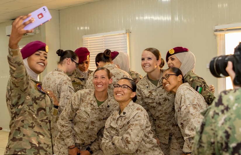 Madaba resident Pvt. Hanady Al-Shakhatreh (left), with Jordan Armed Forces-Arab Army Quick Reaction Force Female Engagement Team (FET), takes a selfie with her comrades and members of the 11th Marine Expeditionary Unit FET following the closing ceremony for the subject matter exchange between the two countries August 7, 2019. The U.S. is committed to the security of Jordan and to partnering closely with JAF to meet common security challenges.