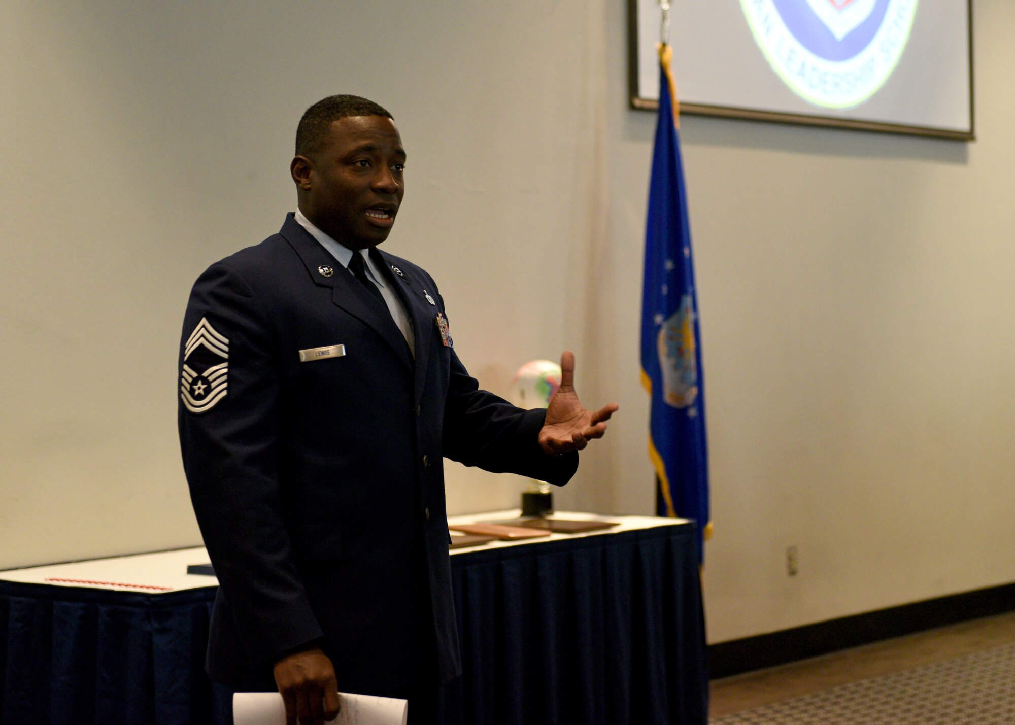 Chief Master Sgt. Brian Lewis, 47th Operations Group superintendent at Laughlin Air Force Base, speaks to the 19-F Airman Leadership School graduates during their ceremony at the event center on Goodfellow Air Force Base, Texas, August 22, 2019. Lewis spoke about how important it is for the graduates to have someone to look up to and to strive to be that person for others. (U.S. Air Force photo by Airman 1st Class Robyn Hunsinger/Released)