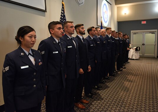 Airman Leadership School graduates form a line before being congratulated by leadership, instructors, and guests during the ALS graduation at the event center on Goodfellow Air Force Base, Texas, August 22, 2019. The uniformed members and civilian employees completed the four-week course to learn leadership skills. (U.S. Air Force photo by Airman 1st Class Robyn Hunsinger/Released)