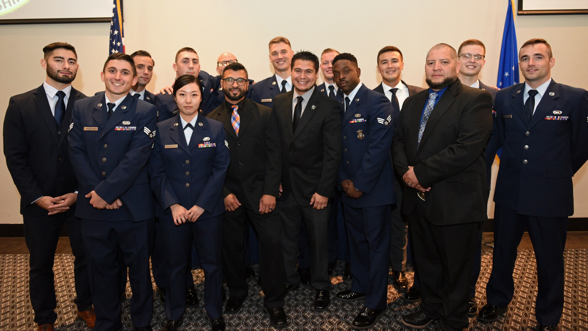 Airmen and civilian graduates of Airman Leadership School pose for a group photo after successfully completing their training during the ALS Graduation on the event center at Goodfellow Air Force Base, Texas, August 22, 2019. Goodfellow hosted personnel from Laughlin AFB and Ohio National Guard to participate in the four-week leadership course. (U.S. Air Force photo by Airman 1st Class Robyn Hunsinger/Released)