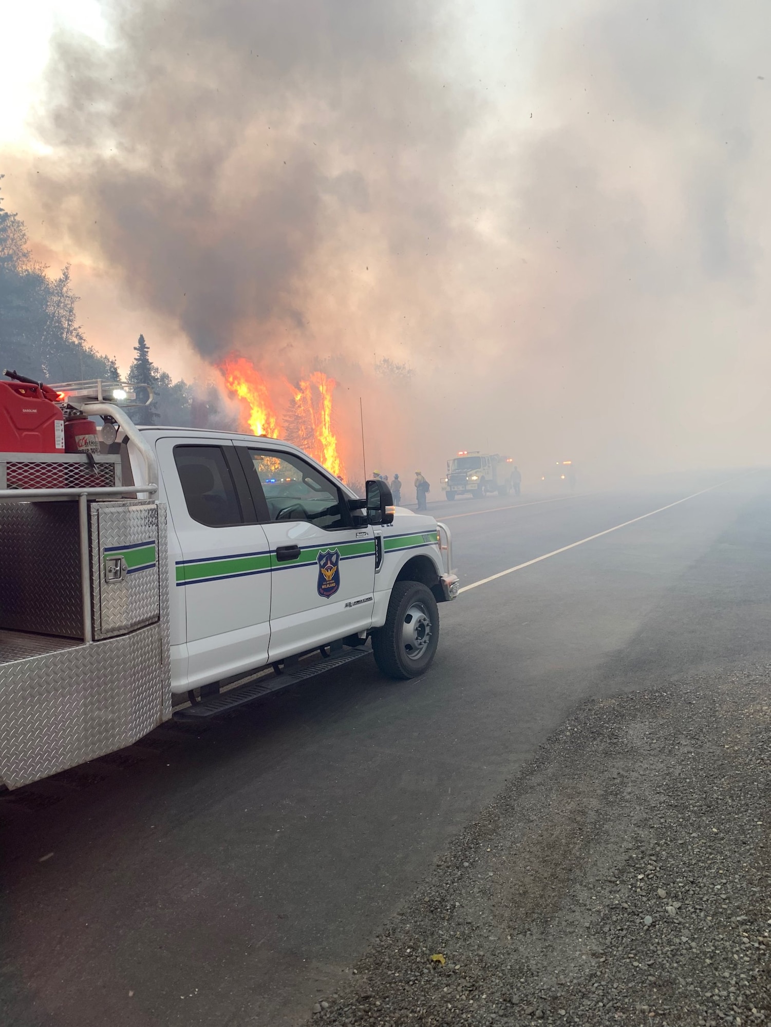 Joint Base Elmendorf-Richardson firefighters engage in fire suppression efforts on the McKinley Fire near mile marker 90.5 along the Parks Highway in Alaska, Aug. 18, 2019. The Matanuska-Susitna area fire management officer requested assistance from the JBER taskforce, which immediately responded and fought the fire alongside local and state firefighters.