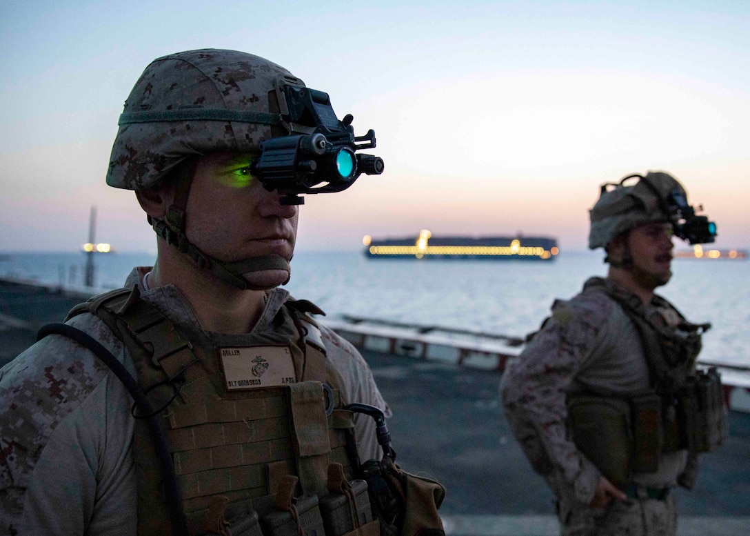 190620-M-QT322-1008 SUEZ CANAL (June 20, 2019) U.S. Sailor Petty Officer 3rd Class Thomas Miller, a hospitla corpsman with the 22nd Marine Expeditionary Unit, tests night vision goggles on the flight deck of the San Antonio-class amphibious transport dock ship USS Arlington (LPD 24) before transiting the Suez Canal, June 20. The 22nd MEU and the Kearsarge Amphibious Ready Group are deployed to the U.S. 5th Fleet area of operations in support of naval operations to ensure maritime stability and security in the central region, connecting the Mediterranean and the Pacific through the western Indian Ocean and three strategic choke points. (U.S. Marine Corps photo by Staff Sgt. Andrew Ochoa/Released)