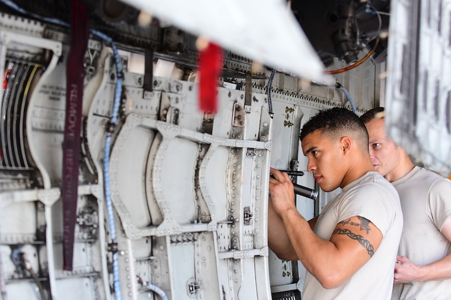 U.S. Air Force Airman 1st Class Jhonny Mayi and Airman 1st Class Chad Stuart, both 355th Equipment Maintenance Squadron crew chiefs, inspects the underside of an A-10 Thunderbolt II during a phase inspection at Davis-Monthan Air Force Base, Arizona, Aug. 8, 2019. During phase, paneling is removed from an A-10 allowing the Airmen assigned to the 355th EMS A-10 Phase section to perform a thorough inspection of the aircraft from the inside out. (U.S. Air Force photo by Airman 1st Class Kristine Legate)