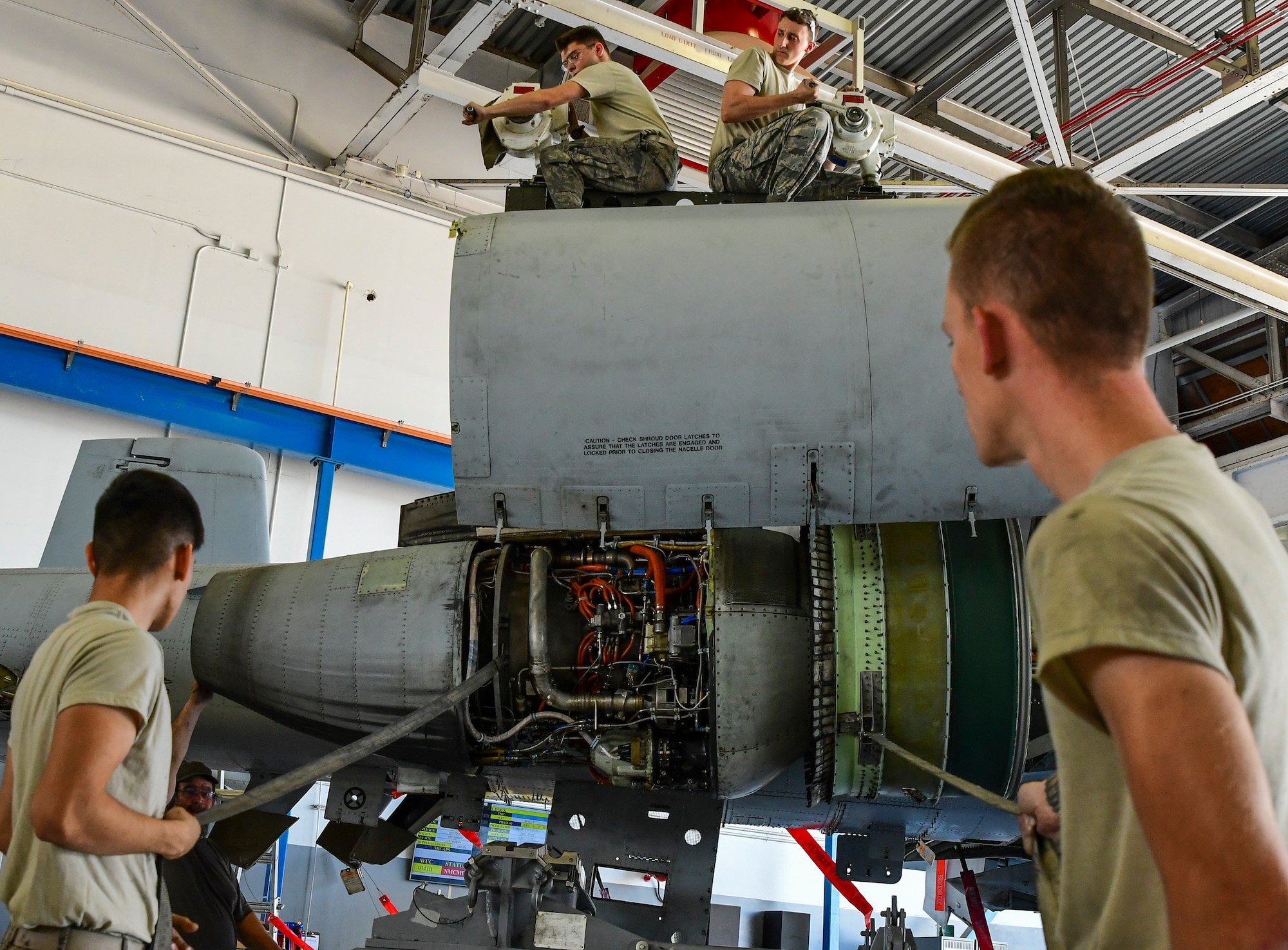 a photo of airmen working on an A-10