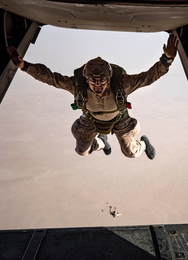 CAMP BEUHRING, Kuwait (April 19, 2019) – U.S. Marine Gunnery Sgt. Malachi Even, the platoon sergeant for Maritime Raid Force’s 1st platoon with the 22nd Marine Expeditionary Unit, jumps out of an MV-22 Osprey as part of freefall jump training during Marine Expeditionary Unit Exercise. The training increases parachuting and jumpmaster proficiency, and ensures the Marines maintain combat readiness. Marines and Sailors with the 22nd MEU and Kearsarge Amphibious Ready Group are currently deployed to the U.S. 5th Fleet area of operations in support of naval operations to ensure maritime stability and security in the Central region, connecting the Mediterranean and the Pacific through the western Indian Ocean and three strategic choke points. (U.S. Marine Corps photo by Sgt. Aaron Henson/Released)
