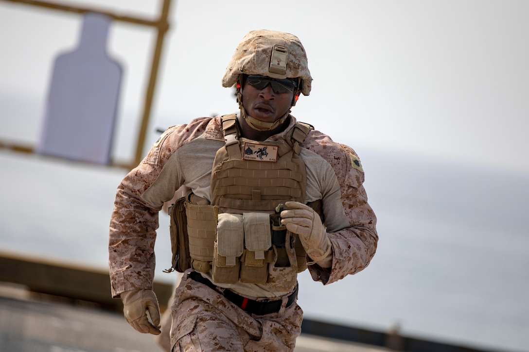 U.S. Marine Sgt. Nathaniel Dunchie, an infantry squad leader with the 22nd Marine Expeditionary Unit, sprints during a stress shoot on the flight deck of the Whidbey Island-class dock landing ship USS Fort McHenry (LSD-43). The purpose of this shoot tests the Marine’s marksmanship fundamentals in a stressful environment by having the Marines perform several exercises before shooting. Marines and Sailors with the 22nd MEU and Kearsarge Amphibious Ready Group are currently deployed to the U.S. 5th Fleet area of operations in support of naval operations to ensure maritime stability and security in the Central Region, connecting the Mediterranean and the Pacific through the western Indian Ocean and three strategic choke points. (U.S. Marine Corps photo by Lance Cpl. Antonio Garcia/Released)