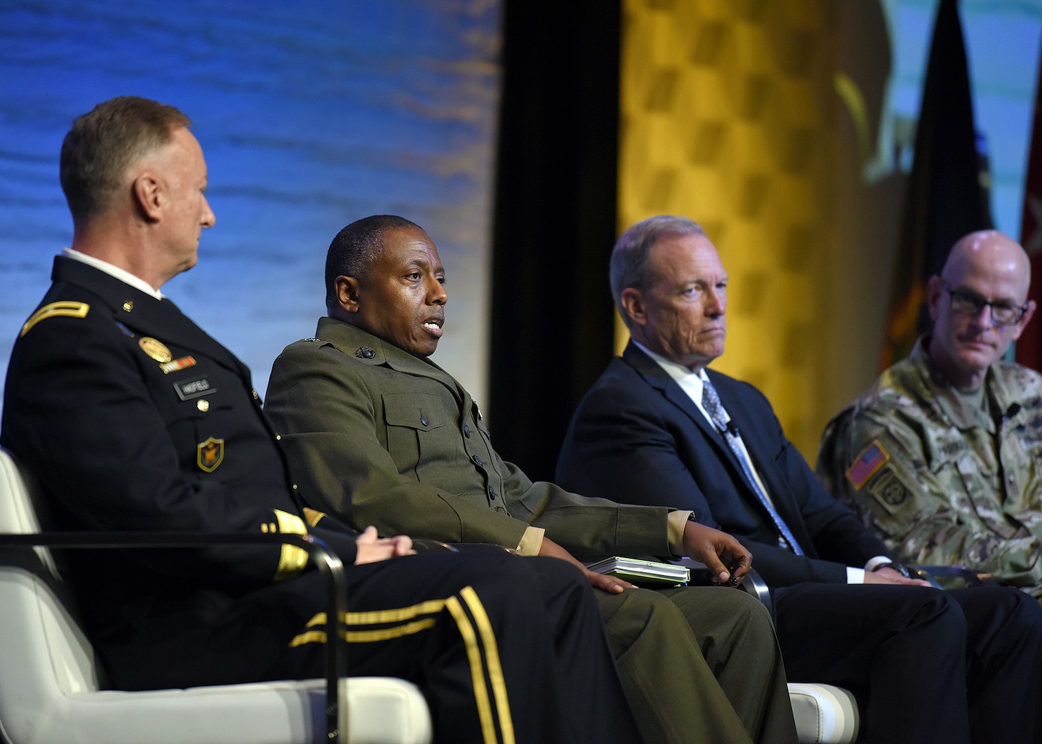 U.S. Marine Corps Brig. Gen. Dimitri Henry, U.S. Central Command director of intelligence, second from left, discusses breaking down organizational stovepipes during the Defense Intelligence Agency DoDIIS Worldwide Conference Directors of Intelligence panel, Aug. 21, 2019, at the Tampa Convention Center, in Florida.