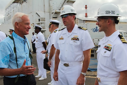 Mayor Kirk Caldwell (left) gets acquianted with CDR George Howell, USS MISSOURI (SSN-780) Commanding Officer, and LCDR Jeremy Nauta, USS MISSOURI (SSN-780) Executive Officer, at the Pearl Harbor Naval Shipyard’s centennial anniversary of Dry Dock One on Aug. 21, 2019, at Dry Dock One.