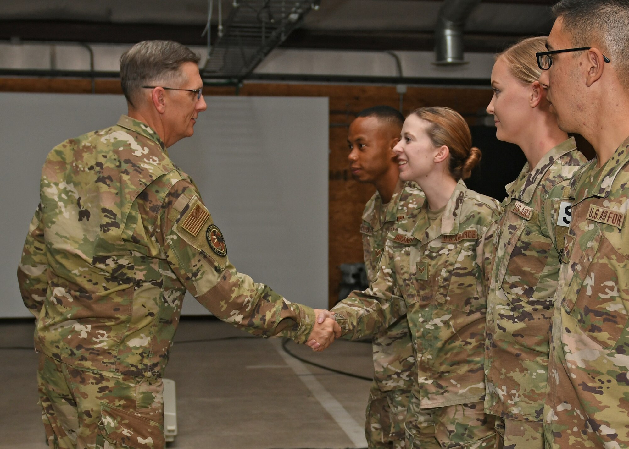 U.S. Air Force Gen. Tim Ray, Commander of Air Force Global Strike Command, greets 7th Bomb Wing security forces Airmen at Dyess Air Force Base, Texas, Aug. 22, 2019. Ray and Chief Master Sgt. Charles Hoffman, Command Chief of AFGSC, participated in firearm training simulators designed to enhance the readiness training of Defenders, and coined Airmen for their outstanding job performance. (U.S. Air Force photo by Senior Airman Susan Roberts)