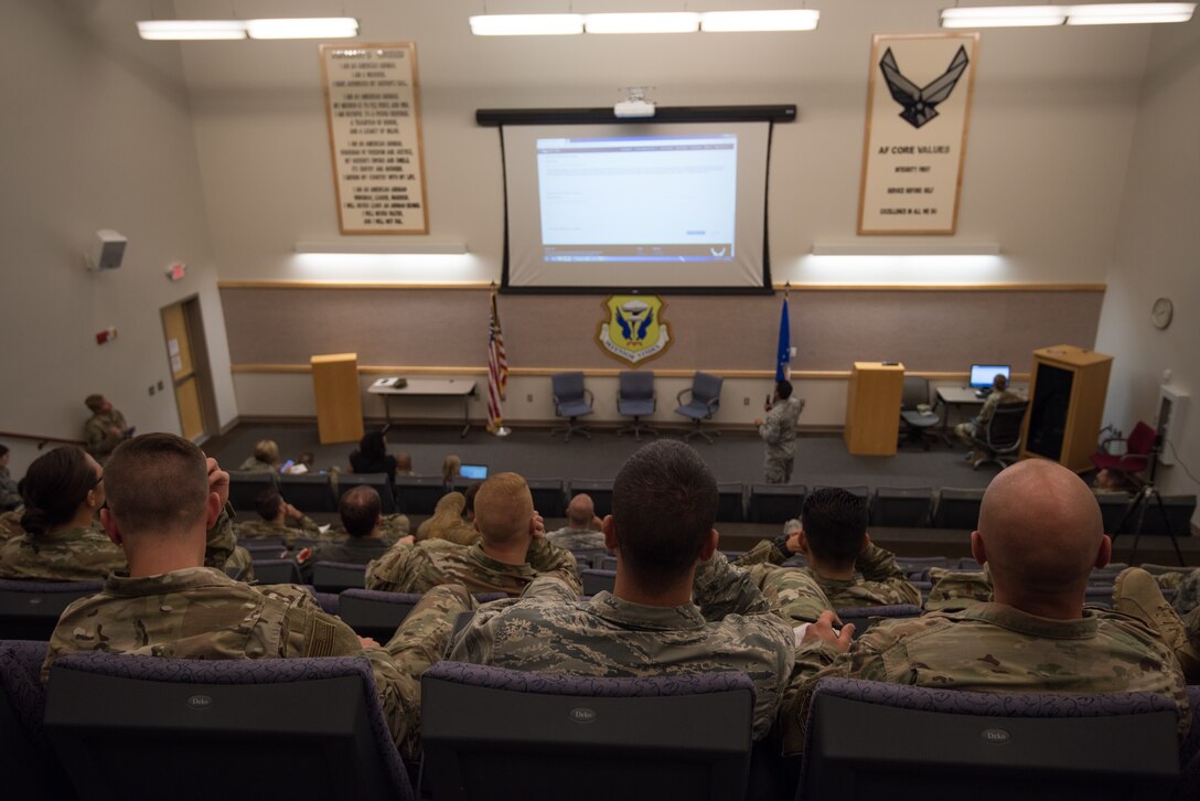 A representative with the Air Force Personnel Center, speaks to officers about comissioned officer career planning and assignments programs during a career town hall event Aug. 14, 2019, at Whiteman Air Force Base, Mo. AFPC personellists visited Whiteman AFB as part of a national road show effort, briefing three town hall sessions that allowed enlisted Airmen, officers and civlian members of Team Whiteman to hear about new developments in the service's personnel adminstration and ask questions specific to their own careers. (U.S. Air Force photo by Tech. Sgt. Alexander W. Riedel)